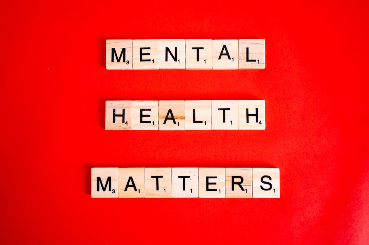 The Art of Drawing Readers In: Your attractive post title goes here Wooden tiles spelling 'Mental Health Matters' on a vivid red background.